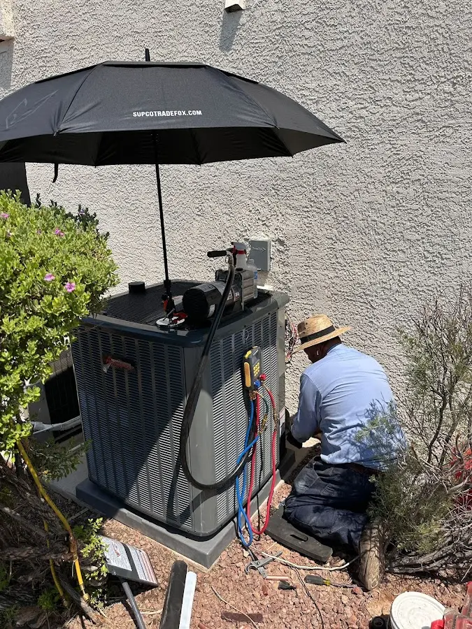 HVAC technician performing outdoor AC maintenance in Seffner